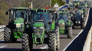 epa11149493 Farmers with their tractors block the highway to the Tarragona's Port during the eighth day of protests by farmers in Tarragona , Spain on 13 February 2024. Farmers protest against green measures planned by the EU, in defense of fairer trade agreements and for aid to deal with any crisis like drought that affects the sector nowadays.  EPA/Enric Fontcuberta
