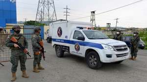 epa09032556 A Forensic Medicine vehicle removes the body of a dead inmate during a riot at the Zonal 8 Deprivation of Liberty Center, in Guayaquil, Ecuador, 23 February 2021. More than 50 inmates died in a series of riots that occurred in three prisons in various cities in Ecuador, the National Police confirmed. 'Given the events that occurred today in the Social Rehabilitation Centers of Guayas, Azuay, and Cotopaxi, the Ecuadorian Police are managing their control. At the moment, Criminalistics reports more than 50 PPL (persons deprived of liberty ) deceased,' they said.  EPA/Marcos Pin