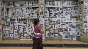 epa13208760 A person reacts in front of photographs of missing people following flash floods at the Tribhuvan University Teaching Hospital (TUTH) in Kathmandu, Nepal,  03 September 2026. Hundreds of bereaved families are performing the ninth-day ritual using kusha grass as a symbolic representation of the deceased, as part of traditional funeral rites for those who believe their missing family members are no longer alive. More than 1,000 people have been killed, and more than 4,000 remain missing across northern Nepal after a glacial collapse and avalanche-triggered flash floods and mudslides along the Bhotekoshi and Trishuli river valleys near the Nepal-Tibet border, causing widespread destruction to settlements and infrastructure, according to the National Disaster Risk Reduction and Management Authority (NDRRMA).  EPA/NARENDRA SHRSTHA