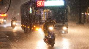 epaselect epa13063454 A motorists maneuvers during a downpour of rain in Taipei, Taiwan, 25 June 2026. The local authorities in Hualien County ordered evacuations in parts of Wanrong and Fenglin following a yellow alert that a nearly full upstream barrier lake might overflow within 48 hours. Rainfall tied to Severe Tropical Storm Mekkhala was expected, prompting officials to open shelters and step up monitoring of key roads and facilities.  EPA/RITCHIE B. TONGO