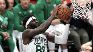 epa11042646 Boston Celtics center Neemias Queta lays up the ball during the second half of the NBA basketball game between the Boston Celtics and Los Angeles Clippers in Los Angeles, California, USA, 23 December 2023.  EPA/ALLISON DINNER  SHUTTERSTOCK OUT