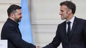 epa12816933 French President Emmanuel Macron (R) and Ukrainian President Volodymyr Zelensky (L) shake hands during a press conference following their talks at the Elysee Palace in Paris, France, 13 March 2026. Zelensky and Macron discussed ongoing support for Ukraine from France and European partners, as well as progress on the 'Coalition of the Willing', a framework for long-term security guarantees.  EPA/LUDOVIC MARIN / POOL  MAXPPP OUT