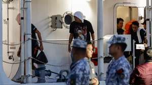 epa12681368 Filipino crew members of the cargo ship M/V Devon Bay disembark from a Philippine Coast Guard (PCG) vessel at the port of Manila, Philippines. 26 January 2026. The PCG on 25 January received custody of 15 ship crew who survived and the remains of two who died after Chinese Coast Guard units pulled the Filipinos from disputed waters of the South China Sea after the M/V Devon Bay reportedly capsized on 23 January.  EPA/ROLEX DELA PENA