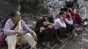 epa13211221 People wait to cross a temporary cable bridge, locally known as the Twin Cross, over the Trishuli River following flash floods in Nuwakot district, Nepal, 04 September 2026. Two people were rescued alive from a hydropower tunnel more than a week after an avalanche-triggered flash flood devastated river valleys along the Nepal-Tibet border, according to local authorities.  EPA/NARENDRA SHRESTHA