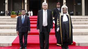 epa10083554 A handout photo made available by the Sri Lankan Parliament Media Unit shows Ranil Wickremesinghe (C) arrives to his swearing-in ceremony at the parliamentary complex in Colombo, Sri Lanka, 21 July 2022. The Sri Lankan parliament the previous day elected Ranil Wickremesinghe as the country's new President, after accepting the resignation of President Rajapaksa who fled to Singapore through the Maldives following months of anti-government protests fueled by the ongoing economic crisis.  EPA/Sri Lankan Parliament Media Unit  HANDOUT EDITORIAL USE ONLY/NO SALES