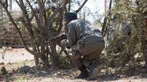 epa05199701 Staff of Mozambican anti poaching authorities demonstrate their skills to journalists at the Limpopo National Park, just across the Kruger National Park, Gaza Province, Mozambique, 07 March 2016. The Mozambican authorites showed members of the media how they handle real life poaching situations. Mozambican authorities is working hand in hand with South African National Parks (SANPARKS) in an effort to stop poaching.  EPA/SHIRAAZ MOHAMED