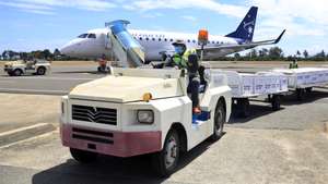 epa09409290 Workers unload AstraZeneca (Vaxzevria) Covid-19 vaccines donated by the Australia’s government from an airplane during the arrival at Nicolau Lobato International Airport in Dili, East Timor, also known as Timor Leste, 11 August 2021. East Timor has recorded more than 11,000 coronavirus (COVID-19) cases since the beginning of the pandemic.  EPA/ANTONIO DASIPARU