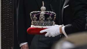 epa09937660 The Imperial State Crown is carried for the State Opening of Parliament in the House of Lords at the Palace of Westminster, London, Britain 10 May 2022. The Prince of Wales is representing the Queen who will be absent for the first time in over fifty years. Buckingham Palace announced that for the first time since 1963 Queen Elizabeth II would not be delivering the Queen’s Speech. The UK government are set to introduce 38 new laws including the controversial Public Order Act.  EPA/TOLGA AKMEN