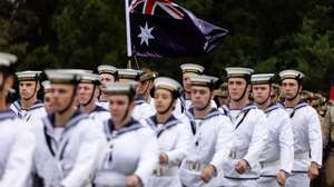 epa11104563 ADF Tri-Service Royal Guard of Honor and members of the Royal Australian Navy Band attends a flag raising ceremony at Government House on Australia Day in Melbourne, Australia, 26 January 2024. Australia Day, the official national day of Australia, is celebrated every year on 26 January. It commemorates the 1788 landing of the First Fleet and the raising of Great Britain&#039;s Union. Some people view it as a day of reflection, suggesting a change of date or even abolishing the holiday altogether. While changing the date has minority support, polls show some backing, especially among Australians under 30.  EPA/DIEGO FEDELE NO ARCHIVING AUSTRALIA AND NEW ZEALAND OUT