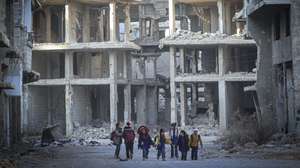 Set of 31 photographs of the Yarmouk refugee camp and distributed on 23 December 2024.
Children walk down a street of Yarmouk refugee camp, established in 1957 to accommodate Palestinian refugees who had fled the 1948 catastrophe and ethnic cleansing of Palestine, in Damascus, Syria, 19 December 2024. Yarmouk, on the southern outskirts of Damascus, was once known as the 'capital of the Palestinian diaspora', before the war in Syria reduced it to row after row of blasted out buildings where there were once falafel stands, pharmacies and mosques. ANTONIO PEDRO SANTOS/LUSA