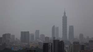 epa12221702 A view of high rise buildings during rain in Taipei, Taiwan, 07 July 2025. Typhoon Danas hit Budai Township, Chiayi County, Taiwan, late Sunday, 06 July, weakening to a tropical storm by Monday morning. The Central Emergency Operation Center reported two deaths in Tainan and 334 injuries due to strong winds and heavy rain.  EPA/RITCHIE B. TONGO