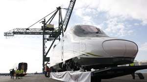 epa04526434 Workers transfer the so-called 'pilgrim AVE' high-speed rail inside a special boat, prior to its departure towards Jeddah (Saudi Arabia), in Barcelona, northeastern Spain, 12 December 2014. The first Talgo AVE high-speed train made in Spain for Saudi Arabia will arrive in the Arab country to start testing prior to its opening. 'Pilgrim AVE' will connect Mecca to Medina in December 2016. EFE/Alejandro Garcia  EPA/ALEJANDRO GARCIA