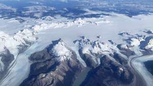 epa10539653 An aerial photograph shows the Darwin mountain range, which counts among the highest concentration of glaciers in the world, in Alberto de Agostini National Park on the island Isla Grande de Tierra del Fuego, Chile, 23 March 2023. Greenpeace warned on 22 March, World Water Day, that Chile faces an almost irreversible climate crisis due to global warming and the accelerated loss of glacial mass.  EPA/Javier Martin