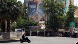 epa12999700 Iranians drive in front of an anti-Israeli billboard hanging in Palestine Square with a sentence reading in Persian, ‘Israel would not see the next fifteen years,' in Tehran, Iran, 28 May 2026. US President Donald Trump recently announced that a potential peace agreement to end the conflict and reopen the Strait of Hormuz has been largely negotiated through Pakistani mediators. However, the US has since launched new strikes in southern Iran.  EPA/ABEDIN TAHERKENAREH RESTRICTIONS: NO Access Israel Media/Persian Language TV Stations Outside Iran/Strictly No Access BBC Persian/VOA Persian/Manoto TV/Iran International TV. (As mandated by Iran's Directorate General for Foreign Media) --