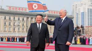 epaselect epa12850108 A photo released by the official North Korean Central News Agency (KCNA) shows Belarusian President Alexander Lukashenko (R) gesturing beside North Korean leader Kim Jong Un during a welcome ceremony at Kim Il Sung Square in Pyongyang, North Korea, 25 March 2026 (issued 26 March 2026). Lukashenko is on his first official visit to North Korea.  EPA/KCNA  EDITORIAL USE ONLY