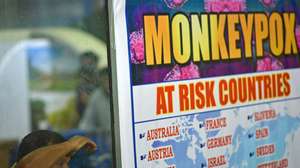 epa10334191 (FILE) - A security personnel looks on next to a list of high-risk countries for the Monkeypox virus, at Chennai International Airport, in Chennai, India, 16 July 2022 (reissued 28 November 2022). The World Health Organization (WHO) in a statement on 28 November 2022 said it "will begin using a new preferred term mpox as a synonym for monkeypox" simultaneously for one year until the term 'monkeypox' is phased out. The decsion was taken after consultations with global experts as "racist and stigmatizing language online, in other settings and in some communities was observed and reported to WHO."  EPA/IDREES MOHAMMED