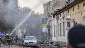 epa11583442 Ukrainian rescuers work at the site of a combined Russian strike that hit a residential area in Lviv, western Ukraine, 04 September 2024, amid the ongoing Russian invasion. At least seven people died, including three children, and 35 others were injured as a result of a Russian combined attack by shock drones and rockets of different types in Lviv, according to Lviv Mayor Andriy Sadovy. Russian troops entered Ukrainian territory on 24 February 2022, starting a conflict that has provoked destruction and a humanitarian crisis.  EPA/MYKOLA TYS