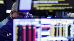 epa08283547 A Trader works on the floor of the New York Stock Exchange in New York, New York, USA, 10 March 2020. The Dow Jones Industrial closed down over 2000 points yesterday but partially recovered in early trading, as investors around the world are continuing to gauge the economic impact of the coronavirus.  EPA/JUSTIN LANE