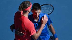 epa11848948 Novak Djokovic of Serbia (R) embraces Alexander Zverev of Germany after retiring in a semifinal match of the Australian Open at Melbourne Park in Melbourne, Australia 24 January 2025.  EPA/JOEL CARRETT AUSTRALIA AND NEW ZEALAND OUT