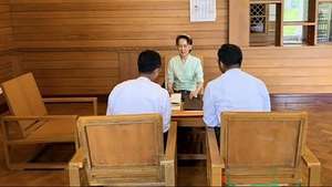 epa13316249 A handout photo made available by the Presidential Press and Information Bureau (PPIB) shows deposed leader Aung San Suu Kyi (C) meeting with officials from the Ministry of Home Affairs in Naypyitaw, Myanmar, 19 October 2026 (issued 20 October 2026). Aung San Suu Kyi received books titled 'The Land Gardeners, Soil to Table' and 'Soil, The World at Our Feet,' along with a package and a sealed diplomatic letter from Britain's King Charles III, according to a press release from Myanmar's Presidential Press and Information Bureau (PPIB).  EPA/MYANMAR PRESIDENTIAL PRESS AND INFORMATION BUREAU HANDOUT BEST QUALITY AVAILABLEHANDOUT EDITORIAL USE ONLY/NO SALES