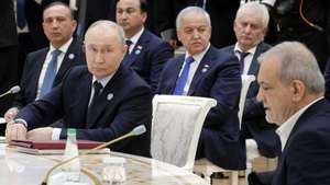 epa13291177 Russian President Vladimir Putin (L) and Iranian President Masoud Pezeshkian (R) attend an expanded format meeting of the Commonwealth of Independent States (CIS) Council of Heads of State at the Avaza national tourist zone outside Turkmenbashi, Turkmenistan, 09 October 2026.  EPA/GAVRIIL GRIGOROV/SPUTNIK/KREMLIN POOL MANDATORY CREDIT