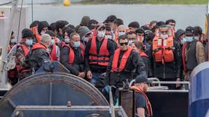 epa10041180 Migrants arrive on a boat after crossing the English Channel from France to Dover,  Britain, 29 June 2022. Under a scheme designed to crack down on migrants landing on British shores after crossing the Channel in small boats, the UK intends to provide those deemed to have arrived unlawfully with a one-way ticket to Rwanda. It is estimated that more than 12,000 people have crossed the Channel in 2022 compared to 5,654 in 2021 by this date.  EPA/STUART BROCK