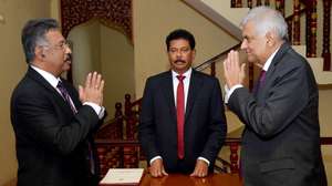 epa10072340 A handout photo made available by the Sri Lankan President's Media Division shows Sri Lankan Prime Minister Ranil Wickremesinghe (R) taking the oath as interim president of Sri Lanka before Chief Justice Jayantha Jayasuriya (L) in Colombo, Sri Lanka, 15 July 2022. Wickremesinghe was sworn in as the Parliament of Sri Lanka on 15 July accepted the resignation of President Gotabaya Rajapaksa, after he fled to Singapore through the Maldives following months of anti-government protests fueled by the ongoing economic crisis.  EPA/Sri Lankan President's Media Division HANDOUT  HANDOUT EDITORIAL USE ONLY/NO SALES