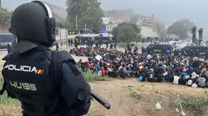 epa13280084 National Police officers remove an immigrant camp from Trampolin's beach in Ceuta, Spain, 04 October 2026. Spain is dealing with a massive migration crisis in the autonomous region of Ceuta after thousands of people crossed into the North African enclave from Morocco in late July 2026.  EPA/REDUAN