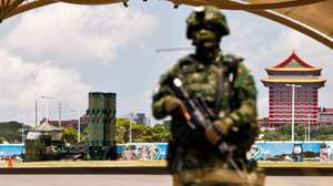 epa13153089 A Taiwanese military personnel stands guard in front of Patriot air defense system deployed at a park as part of the annual Han Kuang military exercises, in Taipei, Taiwan, 06 August 2026. Taiwan’s Han Kuang exercises test combat readiness against a potential Chinese invasion.  EPA/RITCHIE B. TONGO