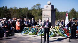 epa12058894 President of the Central Council of Jews in Germany, Josef Schuster, (C) delivers a speech during a memorial event at the former concentration camp Bergen-Belsen to mark the 80th anniversary of the concentration camp's liberation, in Lohheide, Germany, 27 April 2025. Bergen-Belsen, initially established as a prisoner-of-war camp, became a concentration camp in 1943, where more than 52,000 prisoners died, until it was liberated by the British forces on 15 April 1945.  EPA/CLEMENS BILAN