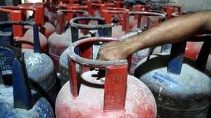 epa10803050 A person reaches for a Liquefied petroleum gas (LPG) cylinder at a shop in Karachi, Pakistan, 16 August 2023. The Liquefied Petroleum Gas (LPG) Association has announced an increase in the price of LPG by 10 Pakistani rupees (0.034 US dollar) per kilogram, while fuel prices were increased by 17.50 Pakistani rupees per liter (0.060 US dollar). The US dollar on 15 August plunged to Rs 300 mark in the open market during intraday trading against the Pakistani rupee days after the National Assembly was dissolved and the new caretaker government was sworn-in.  EPA/REHAN KHAN