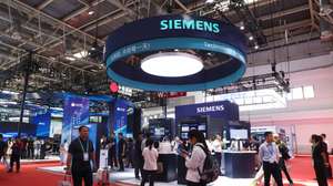 epa12242474 Visitors walk past the booth of German multinational technology conglomerate Siemens during the third China International Supply Chain Expo (CISCE) in Beijing, China, 17 July 2025. The 3rd CISCE exhibition runs from 16 to 20 July 2025 under the theme 'Connecting the World for a Shared Future'.  EPA/WU HAO