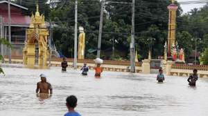 epaselect epa11603206 People carry their belongings at they wade through the flood in Taungoo, Bago division, Myanmar, 14 September 2024. Heavy rains triggered by Typhoon Yagi have caused severe flooding in parts of Myanmar, leaving thousands stranded in their homes, with further heavy rainfall and thunderstorms expected, according to the state weather office. A statement from the Military announced 59,413 households were affected in 34 townships and set up 187 relief camps for the 236,649 people. There were 33 casualties due to the flood in the country including the Naypyitaw.  EPA/NYEIN CHAN NAING