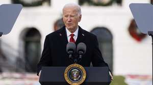 epa11752572 US President Joe Biden gives remarks during an event to commemorate World AIDS Day on the South Lawn of the White House in Washington, DC, US, 01 December 2024. Biden is unveiling the AIDS Memorial Quilt to recognize those who have died due to AIDS-related illnesses.  EPA/Aaron Schwartz / POOL