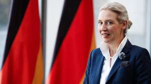 epa13067057 Alternative for Germany (AfD) party and parliamentary group co-chairwoman Alice Weidel speaks during an interview in front of Germany flags during 1st Democracy Congress of the AfD parliamentary group in Berlin, Germany, 26 June 2026.  EPA/CLEMENS BILAN