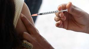 epa09122865 A Tunisian woman receives the Pfizer vaccine against COVID-19, during the anti-COVID-19 vaccination campaign for people aged between 60 and 75 years old, at the Tunis regional vaccination center in Tunis, Tunisia, 08 April 2021. According to Doctor Sghayer Nafissa, the director of Tunis preventive health services and regional coordinator for COVID vaccination, the vaccination campaign started on 13 March 2021, and recently about 800 people who are registered for vaccination receive the vaccine daily.  EPA/MOHAMED MESSARA