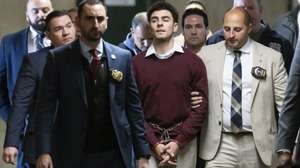 epaselect epa11791136 Luigi Mangione (C) is escorted by police officers following a hearing in New York State Supreme Court on charges that he murdered UnitedHealthcare CEO Brian Thompson in New York, New York, USA, 23 December 2024. Mangione is also facing federal terrorism charges and was arraigned last week in US Federal Court.  EPA/JUSTIN LANE