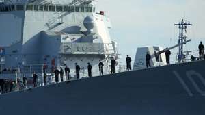 epa04735046 Navy soldiers stand on deck of the U.S. Navy's Arleigh Burke-class destroyer 'USS Jason Dunham' (DDG-109) as it enters the military port in Gdynia, Poland, 06 May 2015. The US warship, on which more than 300 soldiers are deployed, is on a two-day visit to the Polish harbor city. The vessel earlier had taken part in the North Atlantic Treaty Organization's (NATO) naval exercise in the Baltic Sea.  EPA/PIOTR WITTMAN POLAND OUT