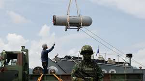 epa12236852 Taiwan navy sailors load sea mines during a drill inside a naval base as part of the annual Han Kuang military exercises, in Kaohsiung city, Taiwan, 14 July 2025. The Taiwanese Armed Forces began the annual Han Kuang exercises, large-scale military drills aimed at testing the troops' defensive capabilities in the event of a potential invasion by China. Han Kuang military exercises are scheduled between 09 to 18 July.  EPA/RITCHIE B. TONGO