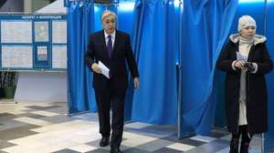 epa10315582 A handout photo made available by Kazakhstan's President press service shows Kazakh President Kassym-Jomart Tokayev (L) casts his ballot during presidential elections at the polling station in Astana, Kazakhstan, 20 November 2022. Kazakhstan holds early presidential elections.  EPA/KAZAKHSTAN PRESIDENT PRESS SERVICE/HANDOUT HANDOUT  HANDOUT EDITORIAL USE ONLY/NO SALES