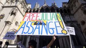 epaselect epa11355053 A supporter holds a placard outside the High Court during WikiLeaks' founder Julian Assange extradition appeal hearing in London, Britain, 20 May 2024. Julian Assange is facing his final extradition hearing at London's High Court on 20 May. Two judges have said that unless assurances are given by the US he would be able to bring an appeal on three grounds. In April 2024 the US provided assurances to the court that Assange would not face death penalty and could rely on the First Amendment right to free speech, and a follow up hearing will now take place for approximately two hours. Assange is facing 175 years in a US prison if the hearing goes against him.  EPA/NEIL HALL