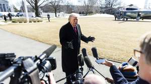epa12735397 US President Donald Trump speaks to reporters as he departs the White House for an event in North Carolina in Washington, DC, USA, 13 February 2026. Trump spoke about the partial government shutdown which will begin at midnight on 14 February.  EPA/JIM LO SCALZO