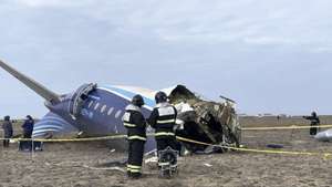 epa11792901 A handout photo made available by the press service of the Ministry for Emergency Situations of Kazakhstan shows emergency specialists working at the crash site of a passenger plane near Aktau, Kazakhstan, 25 December 2024. Azerbaijan Airlines Embraer ERJ-190AR passenger plane flying from Baku to Grozny crashed some three kilometres away from the city of Aktau. According to preliminary information, the incident was caused by a collision between the aircraft and a flock of birds.  EPA/KAZAKHSTAN EMERGENCIES MINISTRY HANDOUT -- BEST QUALITY AVAILABLE -- MANDATORY CREDIT -- HANDOUT EDITORIAL USE ONLY/NO SALES