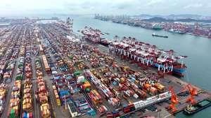 epa12450447 An aerial drone photo shows a view of the container terminal for foreign trade at Qingdao Port in Qingdao, east China's Shandong Province, 13 October 2025. China's total goods imports and exports in yuan-denominated terms rose to 33.61 trillion yuan (about 4.73 trillion U.S. dollars) in the first nine months of 2025, up 4 percent year on year, official data showed 13 October 2025.  EPA/XINHUA / YU FANGPING CHINA OUT / UK AND IRELAND OUT  /       MANDATORY CREDIT EDITORIAL USE ONLY