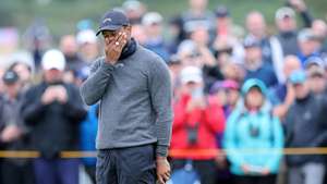 epa11485944 US golfer Tiger Woods reacts during Round 1 of the Open Golf Championships 2024 at the Royal Troon Golf Club, Troon, Britain, 18 July 2024.  EPA/ROBERT PERRY