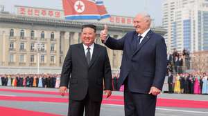 epaselect epa12850108 A photo released by the official North Korean Central News Agency (KCNA) shows Belarusian President Alexander Lukashenko (R) gesturing beside North Korean leader Kim Jong Un during a welcome ceremony at Kim Il Sung Square in Pyongyang, North Korea, 25 March 2026 (issued 26 March 2026). Lukashenko is on his first official visit to North Korea.  EPA/KCNA  EDITORIAL USE ONLY