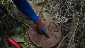 epa13046021 President of the Korea Mine Clearance Institute Kim Ki-ho shows M6a2 AT Landmine as he searches Landmines at the border village of Haemaru-chon near the Demilitarised Zone (DMZ) in Paju, Gyeonggi-do, South Korea, 17 June 2026 (Issued 18 June 2026). Former South Korean soldier Kim Ki-ho has spent more than two decades working alone to remove millions of landmines left along the border since the Korean War (1950–53). Kim said he will continue the high-risk work for the rest of his life to help promote regional peace.  EPA/JEON HEON-KYUN