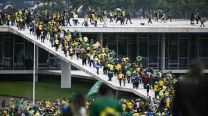 epa10396233 Bolsonaro supporters storm the National Congress in Brasilia, Brazil, 08 January 2023. Hundreds of supporters of former Brazilian President Jair Bolsonaro invaded the headquarters of the National Congress, and also Supreme Court and the Planalto Palace, seat of the Presidency of the Republic, in a demonstration calling for a military intervention to overthrow President Luiz Inacio Lula da Silva. The crowd broke through the cordons of security forces and forced their way to the roof of the buildings of the Chamber of Deputies and the Senate, and some entered inside the legislative headquarters.  EPA/ANDRE BORGES