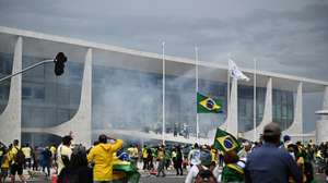 epaselect epa10396226 Bolsonaro supporters storm the National Congress in Brasilia, Brazil, 08 January 2023. Hundreds of supporters of former Brazilian President Jair Bolsonaro invaded the headquarters of the National Congress, and also Supreme Court and the Planalto Palace, seat of the Presidency of the Republic, in a demonstration calling for a military intervention to overthrow President Luiz Inacio Lula da Silva. The crowd broke through the cordons of security forces and forced their way to the roof of the buildings of the Chamber of Deputies and the Senate, and some entered inside the legislative headquarters.  EPA/ANDRE BORGES