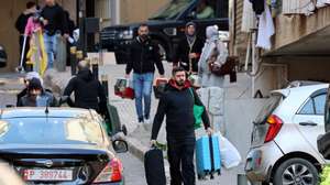 epaselect epa12805919 People carry their belongings after fleeing their homes following Israeli airstrikes in Beirut, Lebanon, 09 March 2026. The Israeli military stated it is conducting strikes across the country targeting Hezbollah infrastructure and personnel. According to the Disaster Management Unit of the Lebanese government, as of 08 March 2026, more than 115,000 people have been internally displaced in collective shelters in Lebanon since Israel resumed strikes on the country.  EPA/WAEL HAMZEH